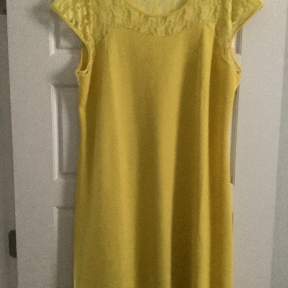 NWOT Never worn. Bright yellow. Front and back of dress is pictured.